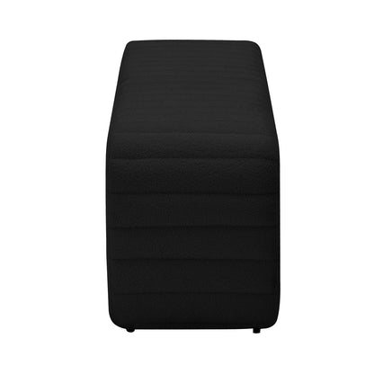 Josie Curved Boucle Fabric Bench Seat in Black, featuring a solid black textured upholstery and small, low legs, offers a sleek, modern design perfect for versatile home seating arrangements.