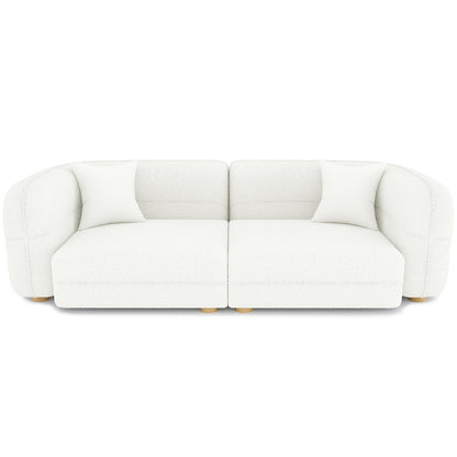 Kaelyn 3 Seater Modular Boucle Sofa with Pillows in Cream, featuring two armless seat modules with rounded backs, upholstered in luxurious bouclé fabric, and supported by short, turned wooden feet.