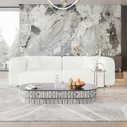 Kaelyn 3 Seater Modular Boucle Sofa with Pillows in Cream, set against a marble-patterned wall, features soft back cushions, boucle fabric, and solid wood legs, complemented by a chic living room setting.