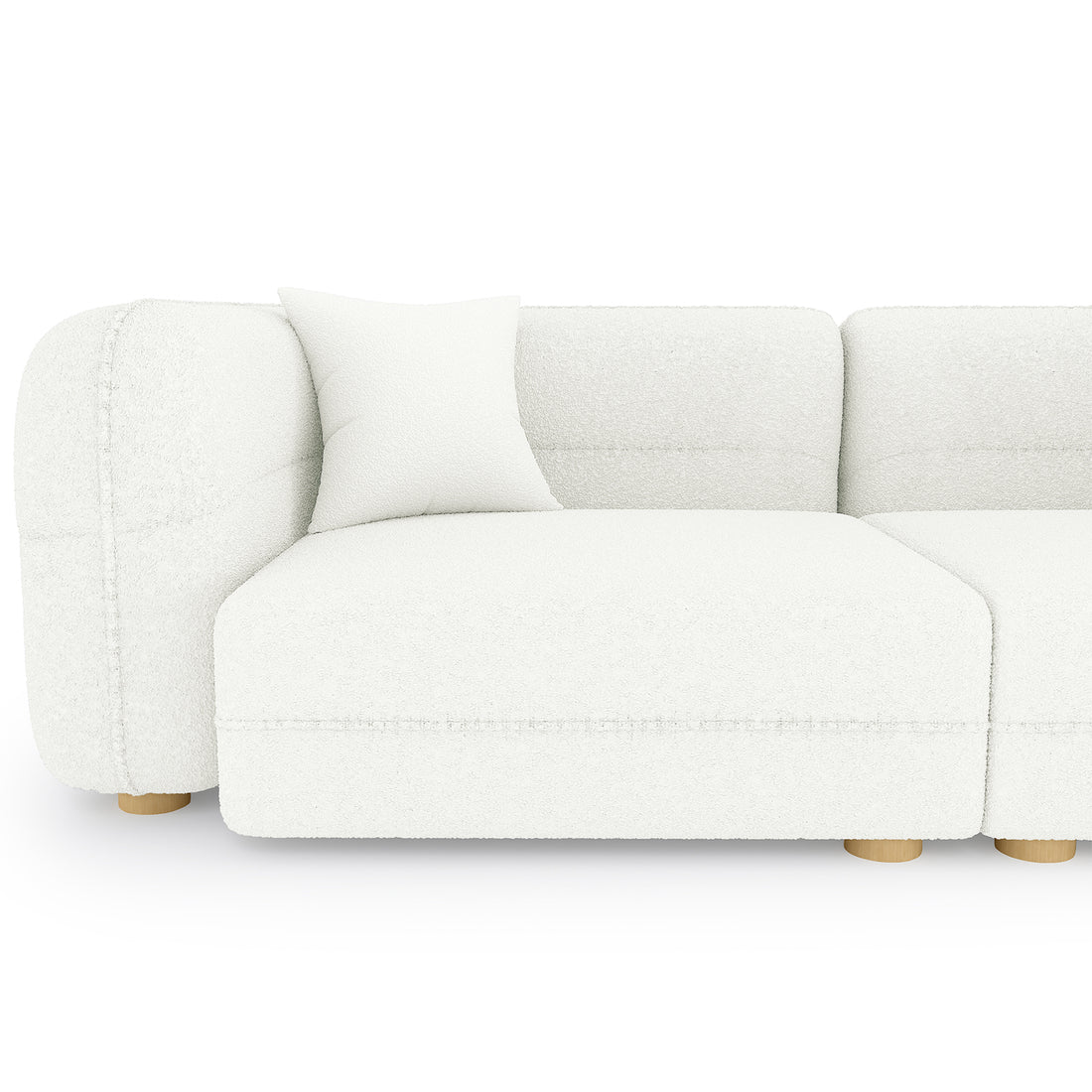 The image features the Kaelyn 3 Seater Modular Boucle Sofa with Pillows in Cream, showcasing its left armrest, seat module, matching throw pillow, and low, round wooden legs.