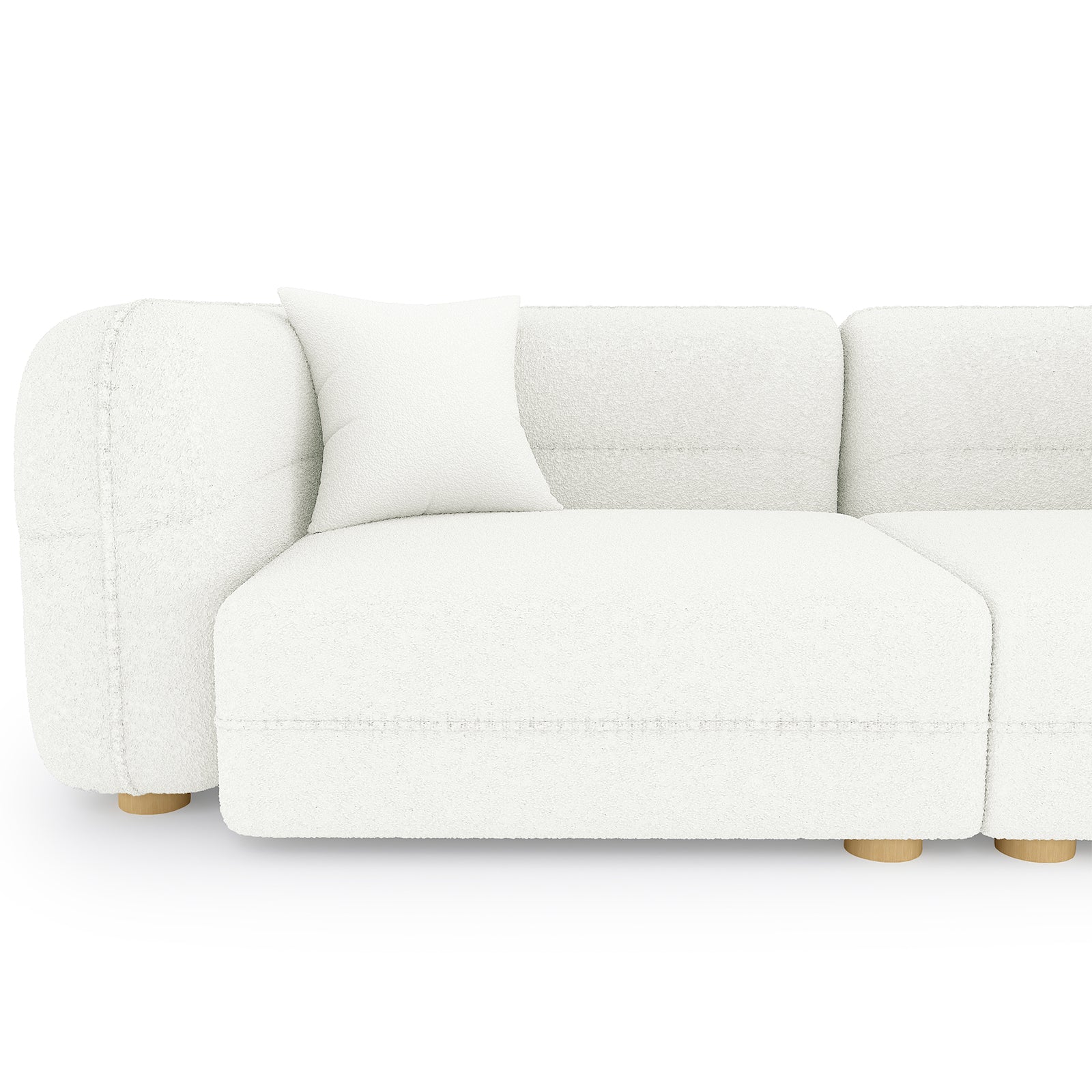 The image features the Kaelyn 3 Seater Modular Boucle Sofa with Pillows in Cream, showcasing its left armrest, seat module, matching throw pillow, and low, round wooden legs.