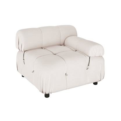 Keila 3 Seater Modular Tufted Sofa with Ottoman in Cream features a heavily cushioned, tufted design, single-seat lounge chair with rounded edges, decorative metal rings, and short black legs.