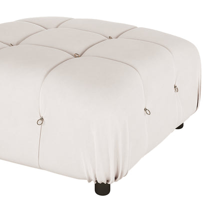 Keila Modular Tufted Velvet Ottoman in Soft Pink, featuring a square shape, tufted velvet upholstery with buttoning and metal ring details, atop short black feet, showcasing modern luxury and functionality.