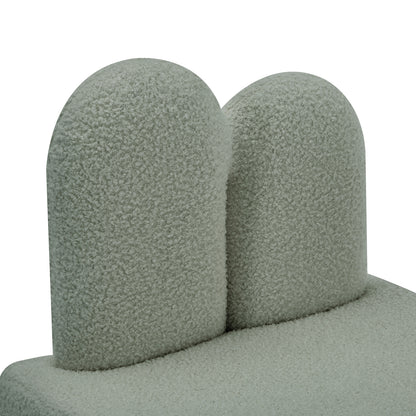 Close-up of the Lenore Boucle Plush Bunny Cushioned Kids Chair, showcasing its soft boucle fabric and whimsical bunny-shaped backrest, designed for comfort and imaginative play in children's spaces.
