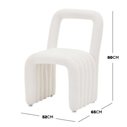 Lycus Boucle Cushioned Metal Frame Accent Chair features a sleek metal frame, plush foam seat, and arched backrest. Its design showcases modern elegance with luxurious boucle upholstery, offering ultimate comfort.