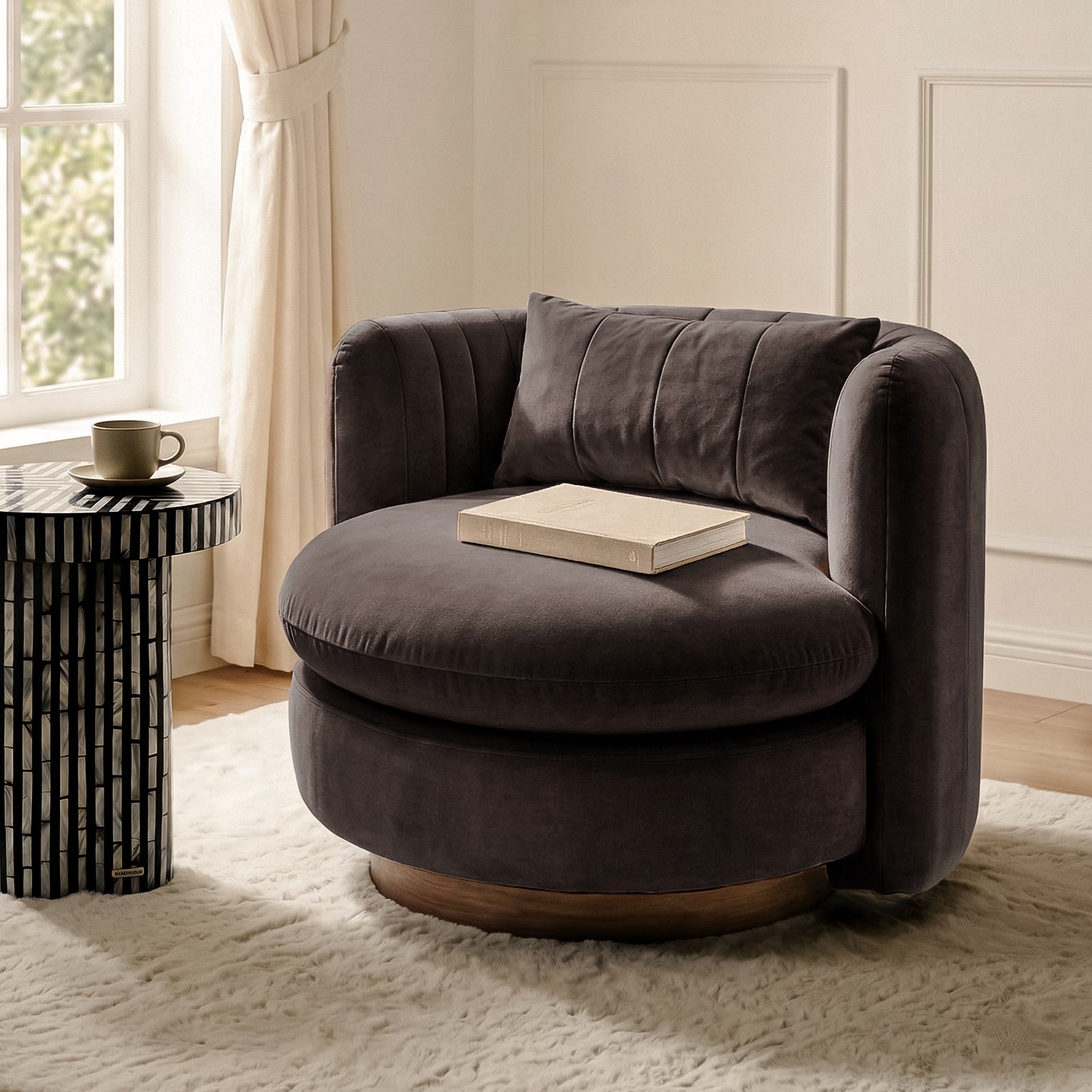 Marvik 360° Swivel Accent Chair in Deep Mocha Brown, upholstered in plush velvet, features a low-profile design with a matching lumbar pillow, set in a cozy living space corner.