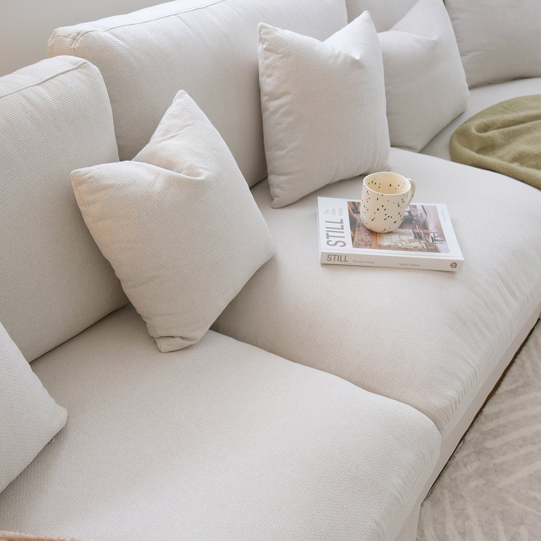 Millie 4-Seater Fabric Corner Chaise Sofa in Light Grey, showcasing plush cushions and a sleek design, ideal for modern living spaces. Features a robust frame and expansive seating for comfort.