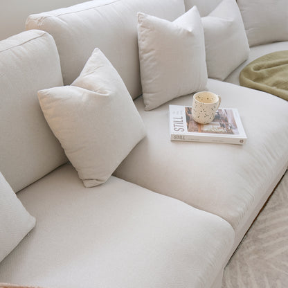 Close-up of Millie 4-Seater Fabric Modular Sofa, featuring plush cushions and a modular design, ideal for comfort and flexibility in living spaces.