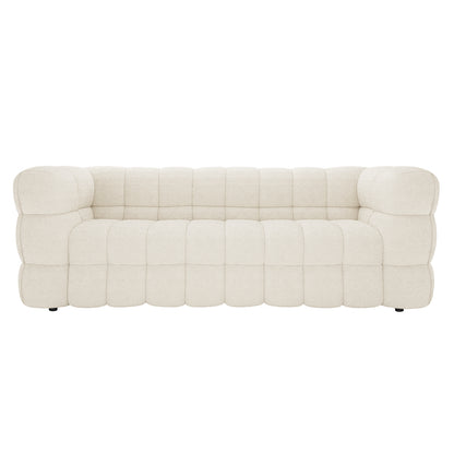 Norah 5 Seater Boucle Sofa Set with Ottoman in Cream White, featuring a tufted, cream-colored, boucle-style upholstery with deep cushion segments, sits on low feet for a modern, stylish look.