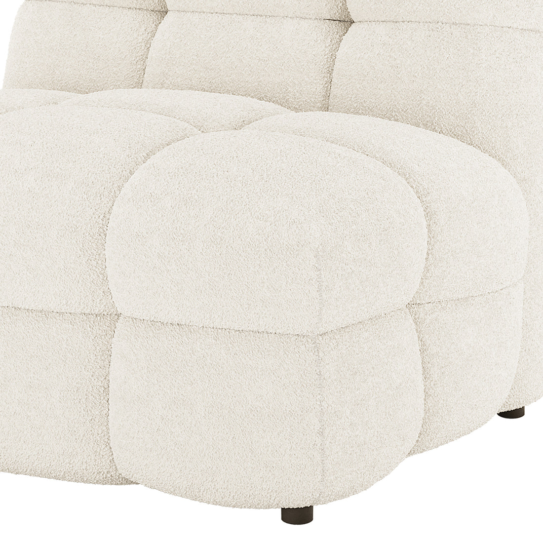Close-up of Norah 5 Seater Bouclé Sofa Set with Ottoman in Cream White showing chunky tufted cushions, cream-white bouclé fabric, and a low, dark wooden leg.