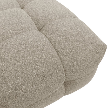 Close-up of the Norah Boucle Single Seater Sofa in Warm Beige, highlighting its tufted, boucle-style upholstery with square stitching and nubby texture, reflecting its luxurious comfort and contemporary design.