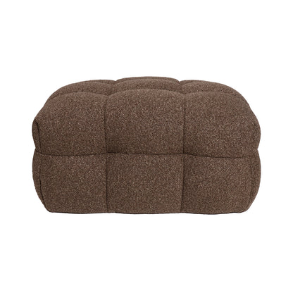 Norah Boucle Ottoman in Brown featuring a low, rectangular design with a plush, tufted surface in nubby fabric, perfect for versatile use as seating or a footrest.