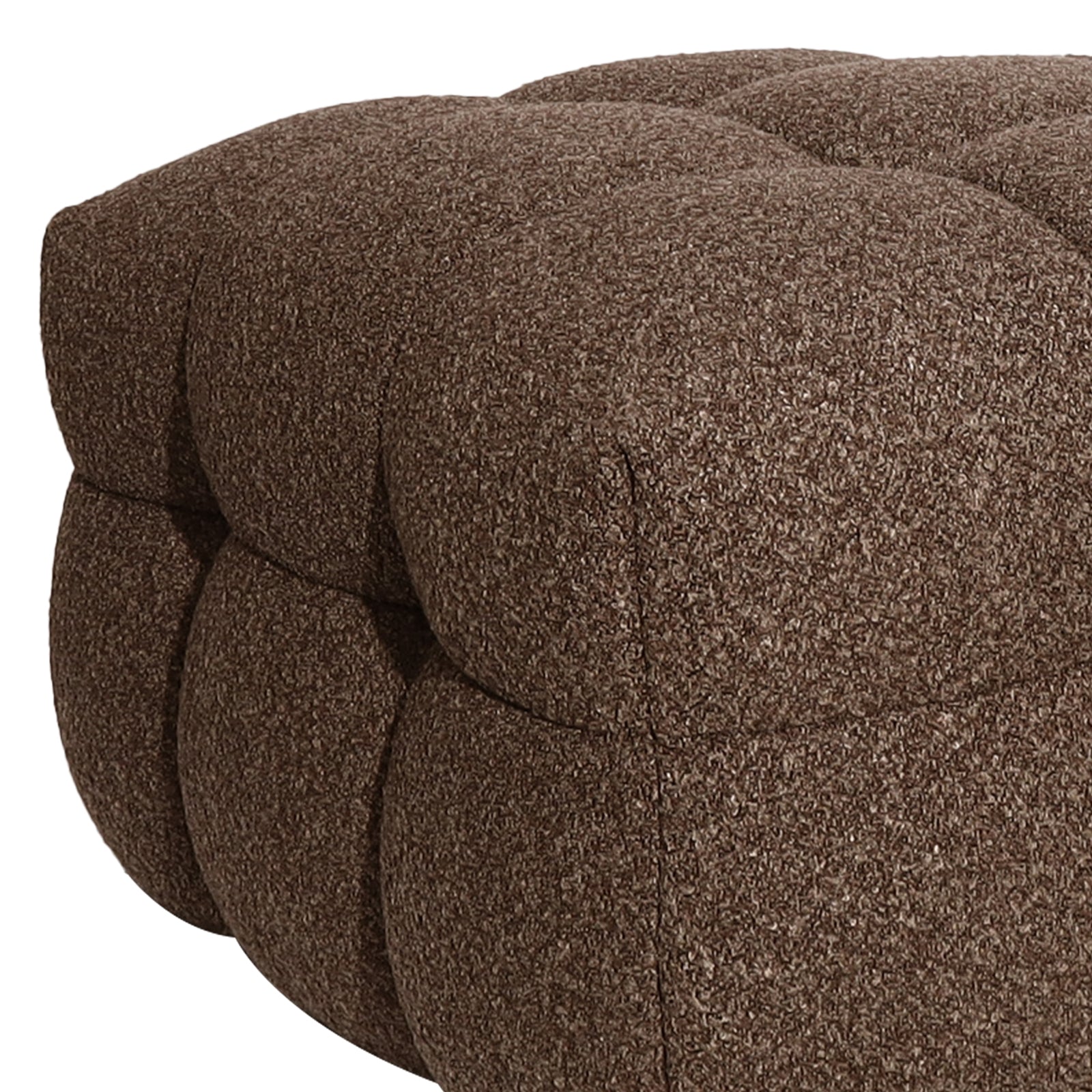 Norah Boucle Ottoman in Brown: Close-up of a plush, tufted ottoman upholstered in boucle fabric, showcasing its rounded button-down sections, ideal for stylish seating or a footrest.