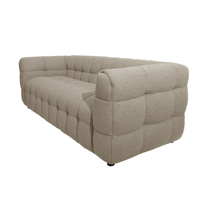Norah 5 Seater Boucle Sofa Set With Ottoman in Warm Beige features a modern, low-profile design with textured bouclé fabric and chunky, quilted square tufting, offering a unified, boxy silhouette.