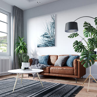 Oslo 3 Seater PU Leather Sofa features a sleek, modern design with PU leather upholstery and sturdy metal legs, offering a comfortable and stylish seating option for contemporary living rooms.