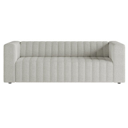 Parisa 4 Seater Tufted Boucle Sofa Set in Light Grey, featuring a modern design with broad arms, low deep seat, and vertical channel stitching on light bouclé fabric upholstery.