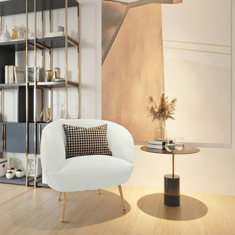 Polilo Bouclé Accent Chair Cream White, featuring a textured bouclé fabric and a matching pillow, showcases modern design with stainless steel legs. Ideal for enhancing luxury and elegance in any room.