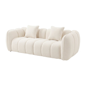 Modern cream-colored sofa with rounded segmented cushions and two matching throw pillows on a white background