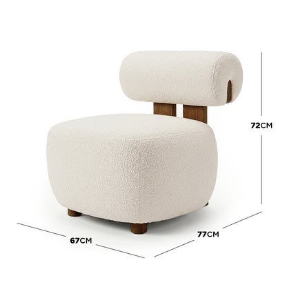 Renley Boucle Armless Accent Chair with low, rounded base and cylindrical backrest on wooden supports, showcasing modern curves and plush boucle texture, ideal for compact spaces.