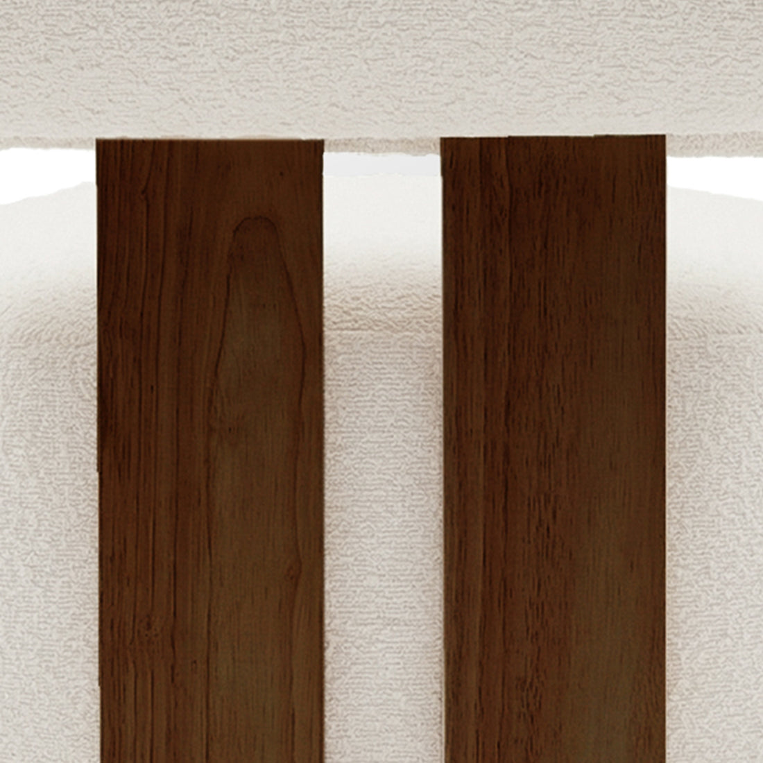 Close-up of the Renley Boucle Armless Accent Chair in Cream White, showcasing dark-stained wooden slats against a white upholstered backdrop, highlighting its elegant design and modern organic lines.
