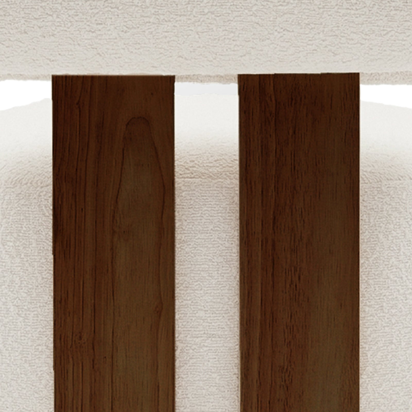 Close-up of the Renley Boucle Armless Accent Chair in Cream White, showcasing dark-stained wooden slats against a white upholstered backdrop, highlighting its elegant design and modern organic lines.