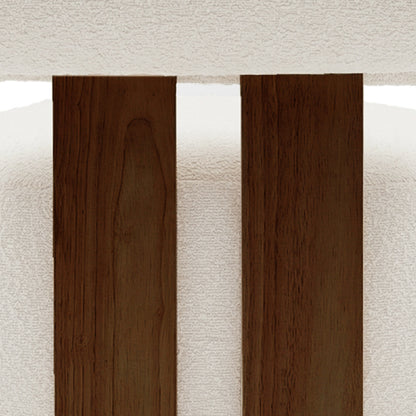 Close-up of the Renley Boucle Armless Accent Chair in Cream White, showcasing dark-stained wooden slats against a white upholstered backdrop, highlighting its elegant design and modern organic lines.