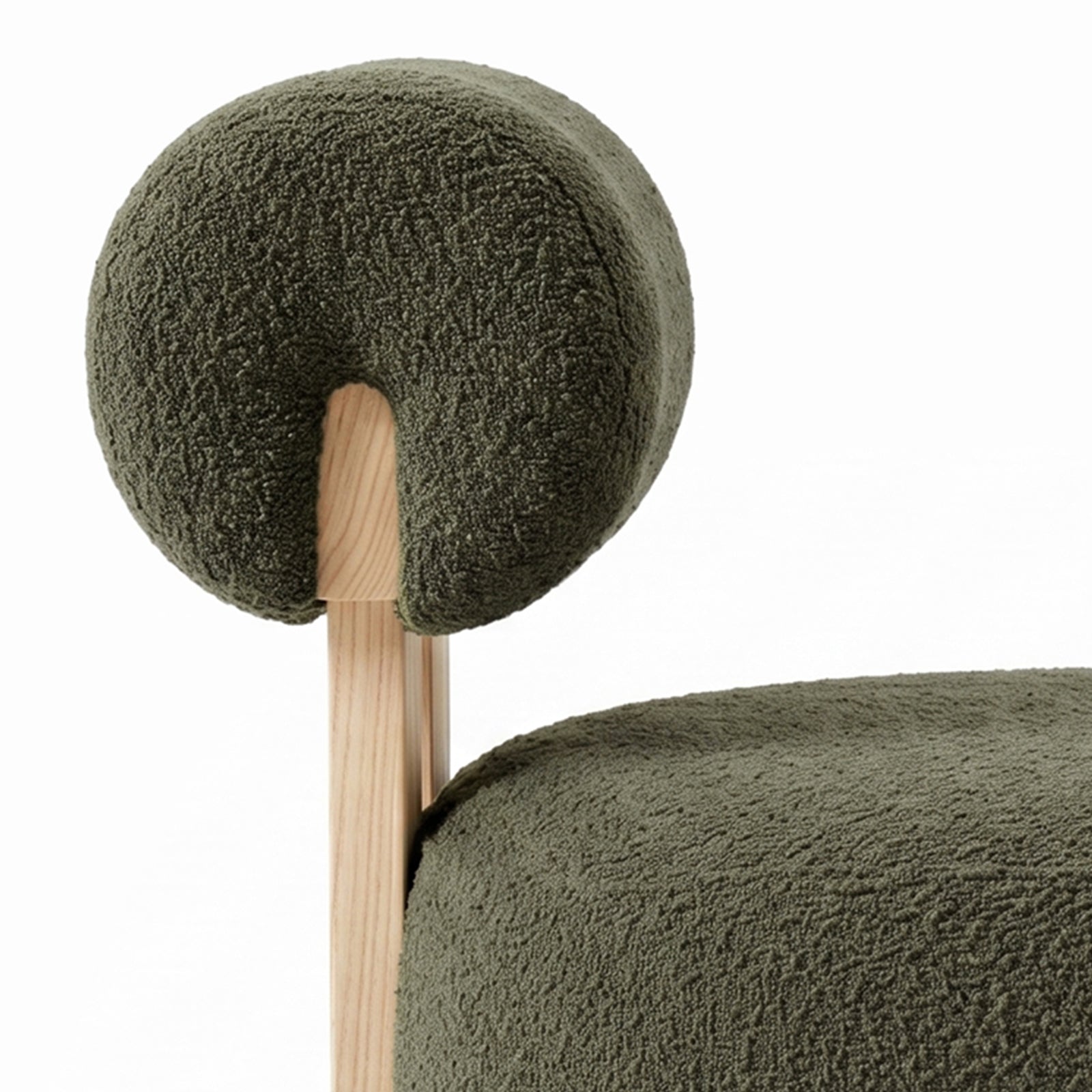 Renley Boucle Armless Accent Chair in Dark Forest Green, showcasing light wood frame, textured olive-green bouclé upholstery, with plush seat cushion and rounded backrest, embodying minimalistic elegance and modern comfort.