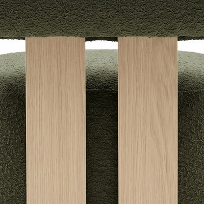 Renley Boucle Armless Accent Chair in Dark Forest Green, showcasing light-oak slats against textured upholstery, highlighting the chair's blend of organic minimalism and robust design.
