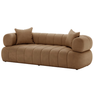 Samira 3 Seater Velvet Sofa - Camel Brown features a plush velvet upholstery with two matching pillows, showcasing a luxurious design. The close-up highlights the sofa's elegant texture and comfortable cushioning.