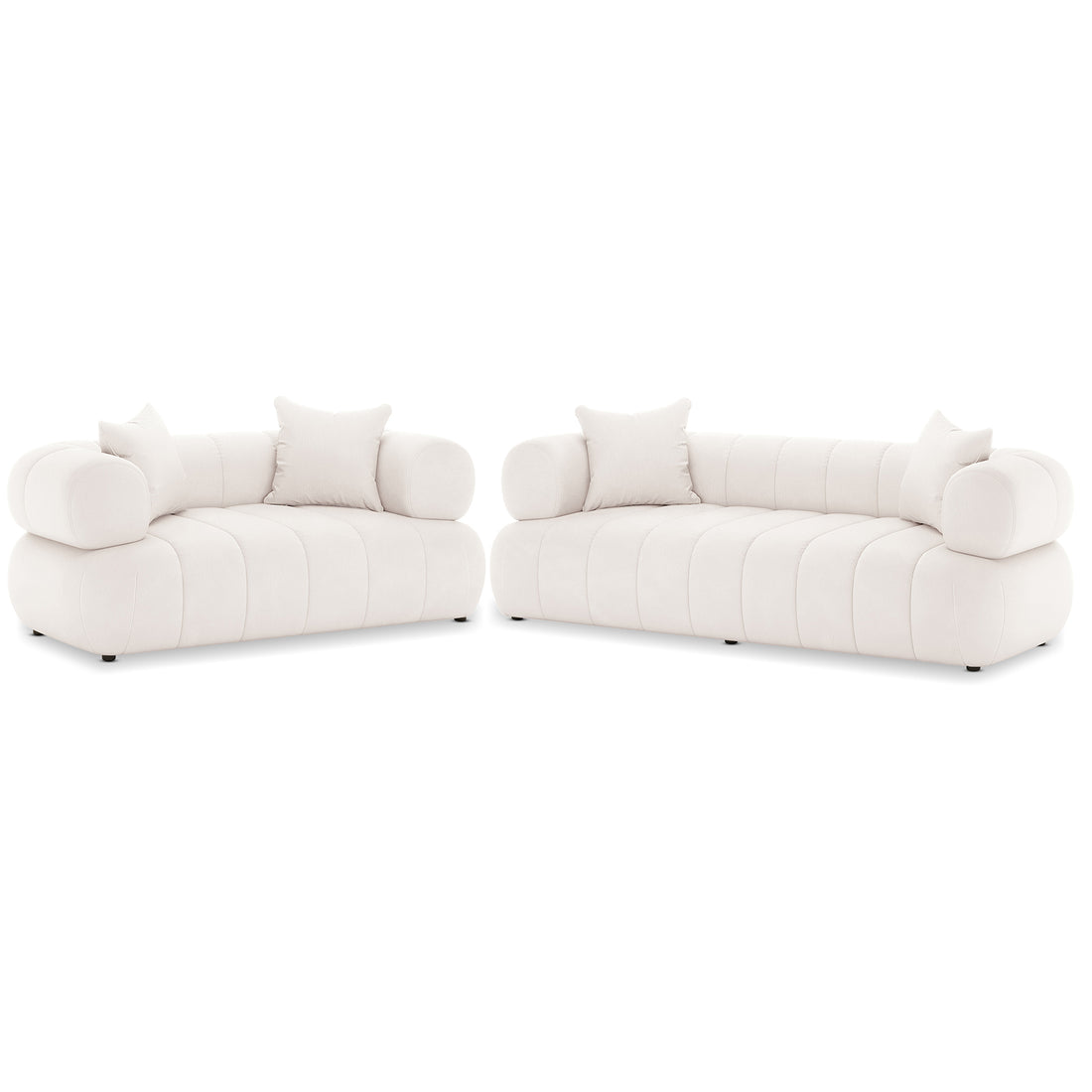 Samira 5 Seater Velvet Sofa Set in Cream, featuring two matching off-white upholstered sofas with low, channel-tufted bases, rounded bolster armrests, and square back-rest pillows, exuding elegance and comfort.