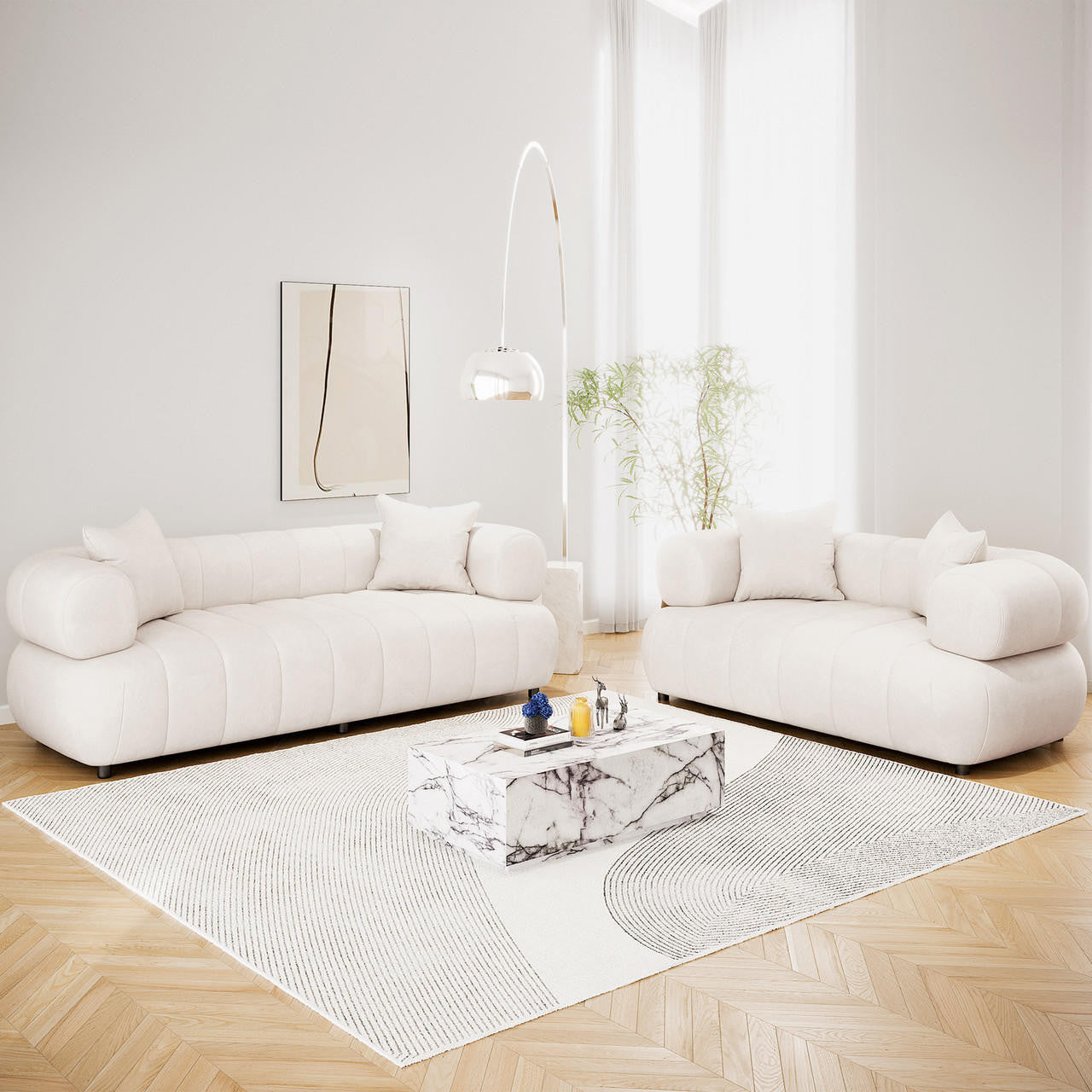 Samira 5 Seater Velvet Sofa Set in Cream, featuring low-profile sofas with cylindrical bolster arms, matching throw pillows, and plush cream velvet upholstery, elegantly arranged in a bright, minimalist living room.
