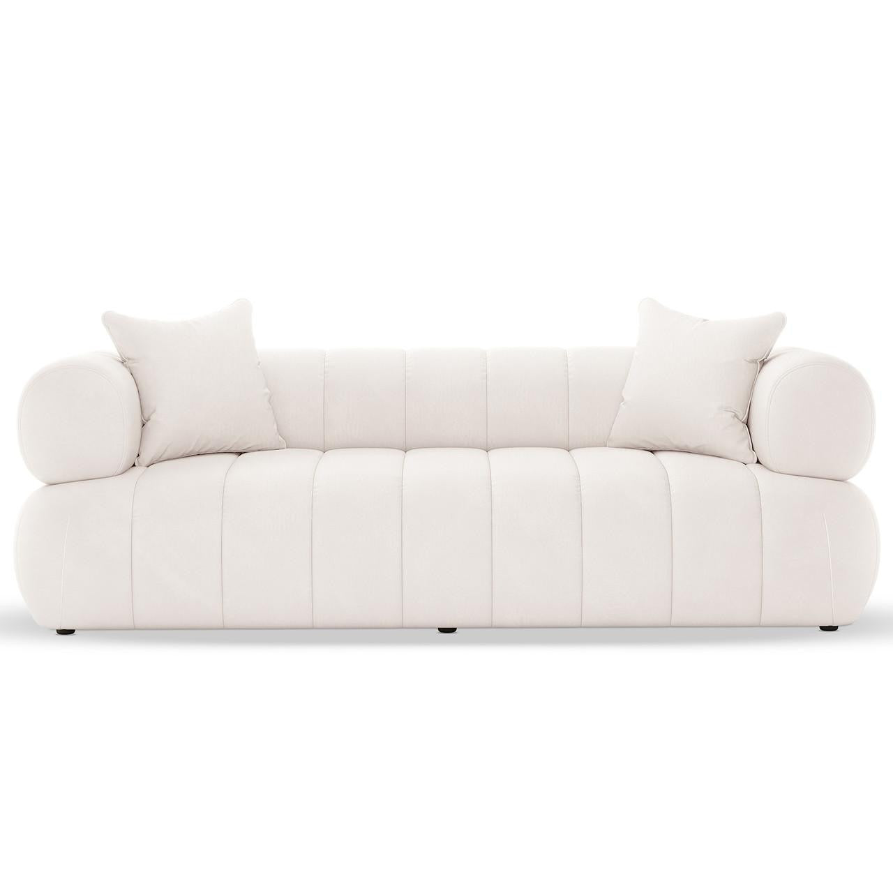 Samira 5 Seater Velvet Sofa Set in Cream, featuring a modern, low-profile design with rounded edges and vertical channel tufting, includes two matching throw pillows for added elegance and comfort.