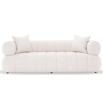 Samira 5 Seater Velvet Sofa Set in Cream, featuring a modern, low-profile design with rounded edges and vertical channel tufting, includes two matching throw pillows for added elegance and comfort.