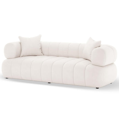 Samira 5 Seater Velvet Sofa Set in Cream features a modern three-seater with off-white vertical-pleated cushions and rounded bolster armrests, complemented by two matching throw pillows.