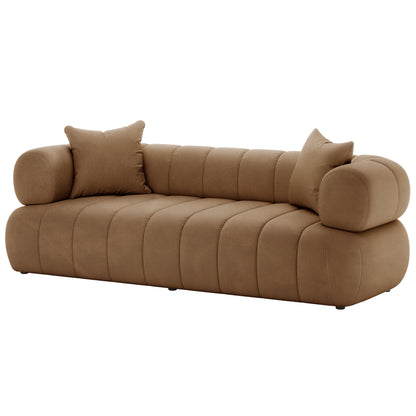 Close-up of the Samira 6 Seater Velvet Sofa Set - Camel Brown, featuring plush velvet upholstery and a visible pillow, highlighting the luxurious texture and elegant design of the couch.