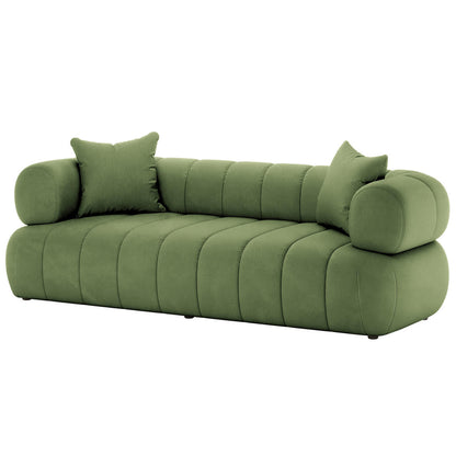 Samira 6 Seater Velvet Sofa Set in Prasinous Green, showcasing plush velvet upholstery, a smooth cushion, and part of the sofa's frame, highlighting its luxurious and inviting texture.