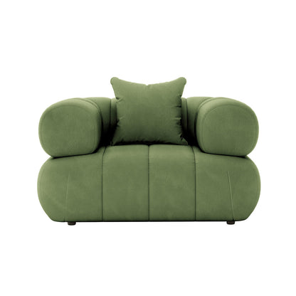 Samira 6 Seater Velvet Sofa Set in Prasinous Green, showcasing its plush velvet fabric and elegant design, with a green pillow on a matching chair in the background.
