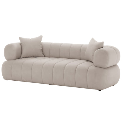 Samira 6 Seater Velvet Sofa Set - Warm Beige featuring a plush white couch adorned with pillows, highlighting its luxurious and comfortable design, perfect for enhancing any living space.