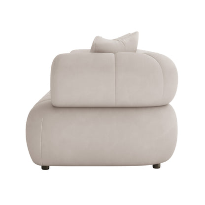 Samira 6 Seater Velvet Sofa Set - Warm Beige, showcasing its plush velvet upholstery and elegant design, with a white couch and pillow visible in the background.