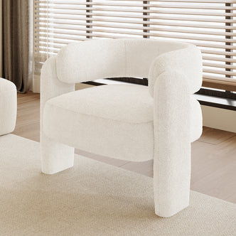 Seto Bouclé Curved Occasional Accent Chair - Eggshell White, featuring a sculptural design in white bouclé fabric on a light wood floor, with a glimpse of a matching ottoman in the background.