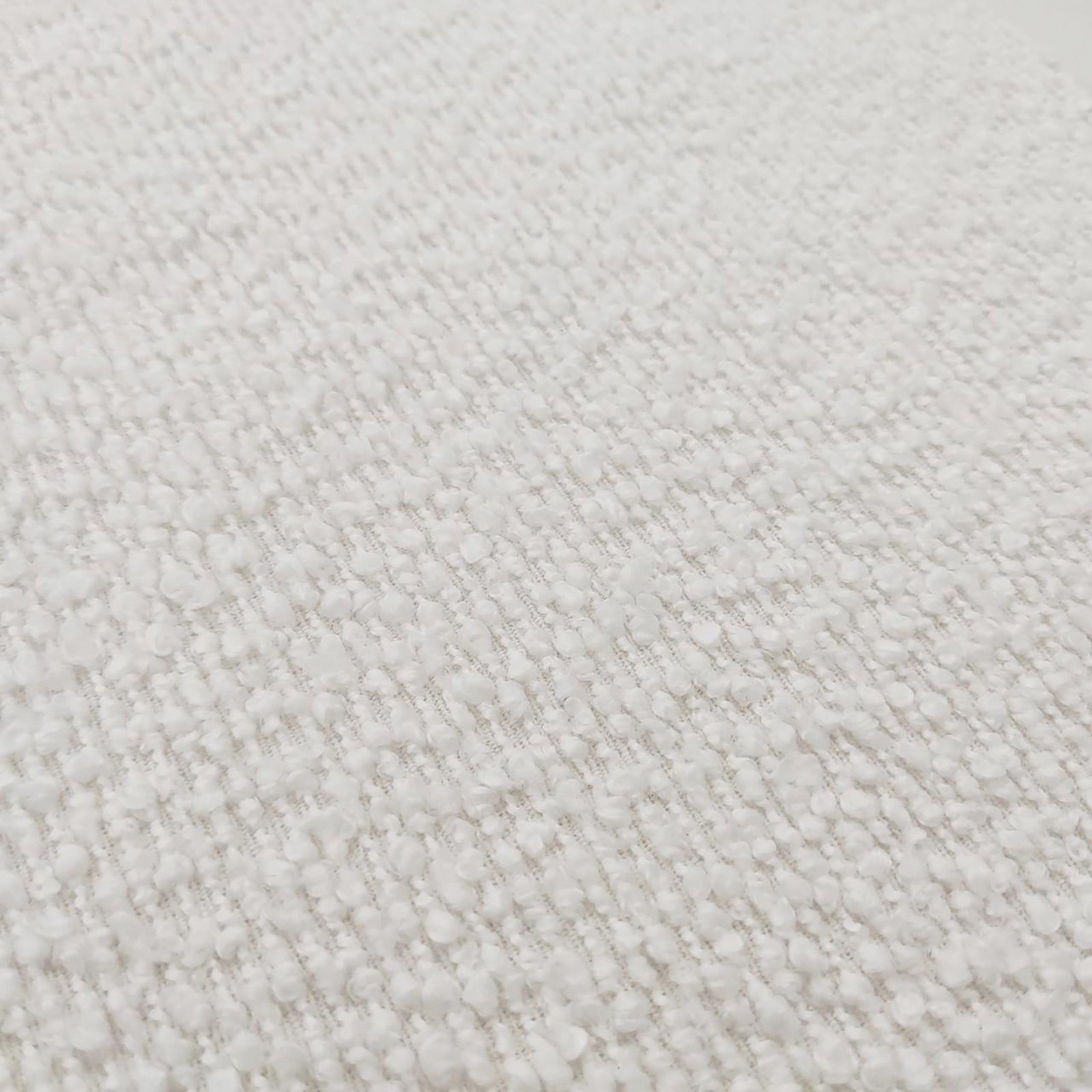 Seto Bouclé Curved Occasional Accent Chair in eggshell white, featuring a soft, loop-pile bouclé fabric with a nubbly texture, highlighting its curved backrest and plush design for stylish comfort.