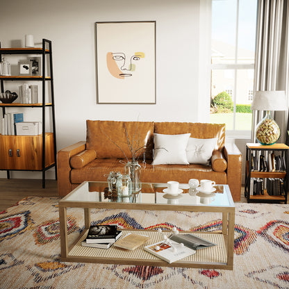Sollia 3 Seater PU Leather Sofa - Tan Brown in a cozy setting, surrounded by books and a cup, showcasing its sleek design and luxurious comfort in a stylish indoor space.