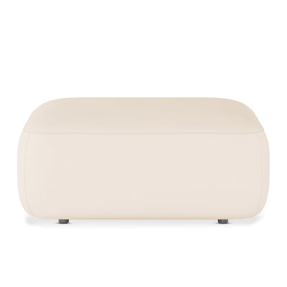 Soraya Velvet Ottoman in Cream White, a low, rectangular piece with softly rounded corners, upholstered in smooth fabric, featuring small dark feet, enhancing modern elegance and versatility in any space.