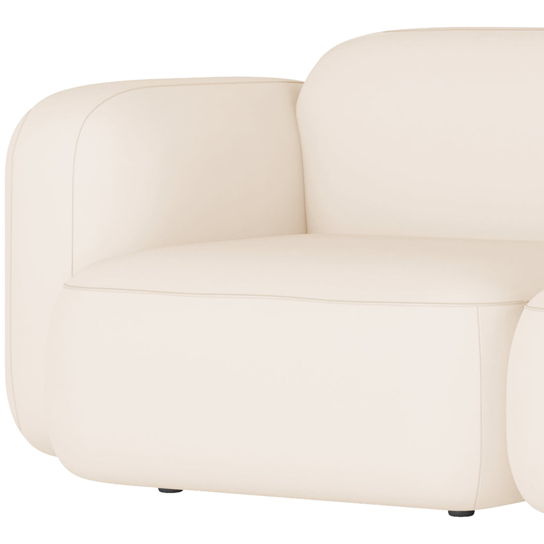 Close-up of the Soraya 2 Seater Velvet Sectional Sofa in Cream White, showcasing its rounded-edge design, smooth light-cream fabric, thick seat cushion, and low armrest with discreet feet visible underneath.