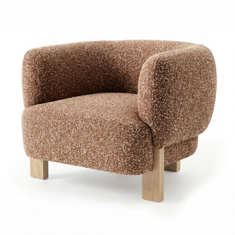 Sornel Boucle Upholstered Accent Chair in Coral, featuring a rounded back and armrests in speckled bouclé fabric, supported by four light wooden legs, offering a modern and cosy seating option.