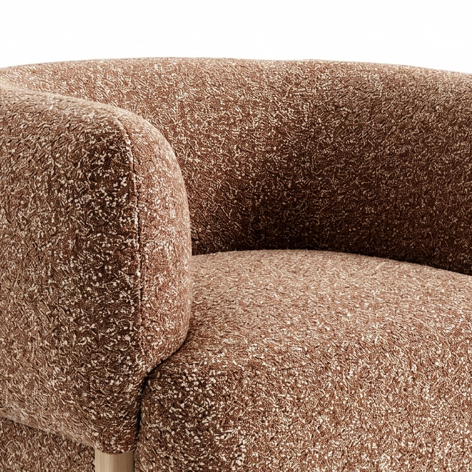 Sornel Boucle Upholstered Accent Chair in Coral features a close-up of its textured, rust-brown boucle fabric and curved form, highlighting a light wood leg and soft upholstery.