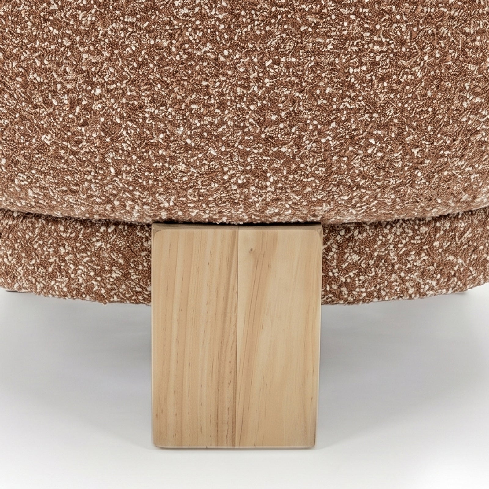 Sornel Boucle Upholstered Accent Chair in Coral, showcasing its speckled, boucle fabric and unfinished wood leg, highlighting its textured warmth and structural design.