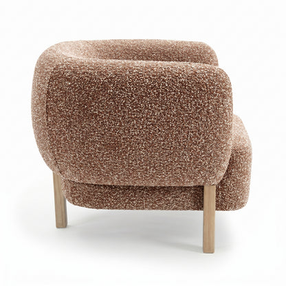 Sornel Boucle Upholstered Accent Chair in Coral, showcasing a rounded back and arms in speckled brown-and-cream boucle fabric, with light-wood legs, highlighting its modern design and high-density comfort.