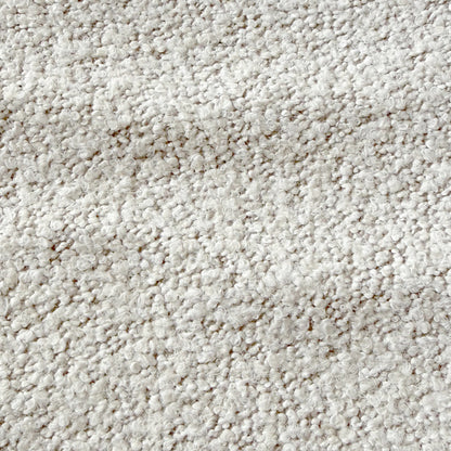 Close-up of the Sornel Boucle Upholstered Accent Chair in Cream White, highlighting its textured loop-pile fabric, emphasizing plushness and inviting design, embodying modern elegance and structural durability.