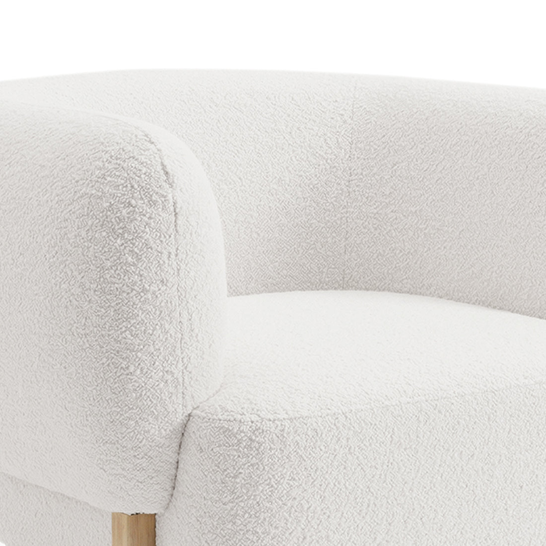 Close-up of the Sornel Boucle Upholstered Accent Chair in Cream White, highlighting its rounded arm and back cushions with textured boucle fabric and a glimpse of the wooden leg beneath.
